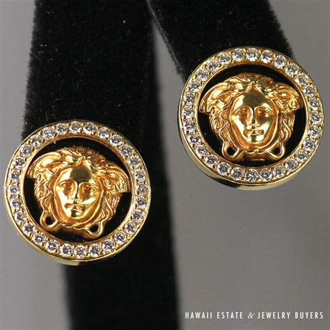 versace 18k earrings.